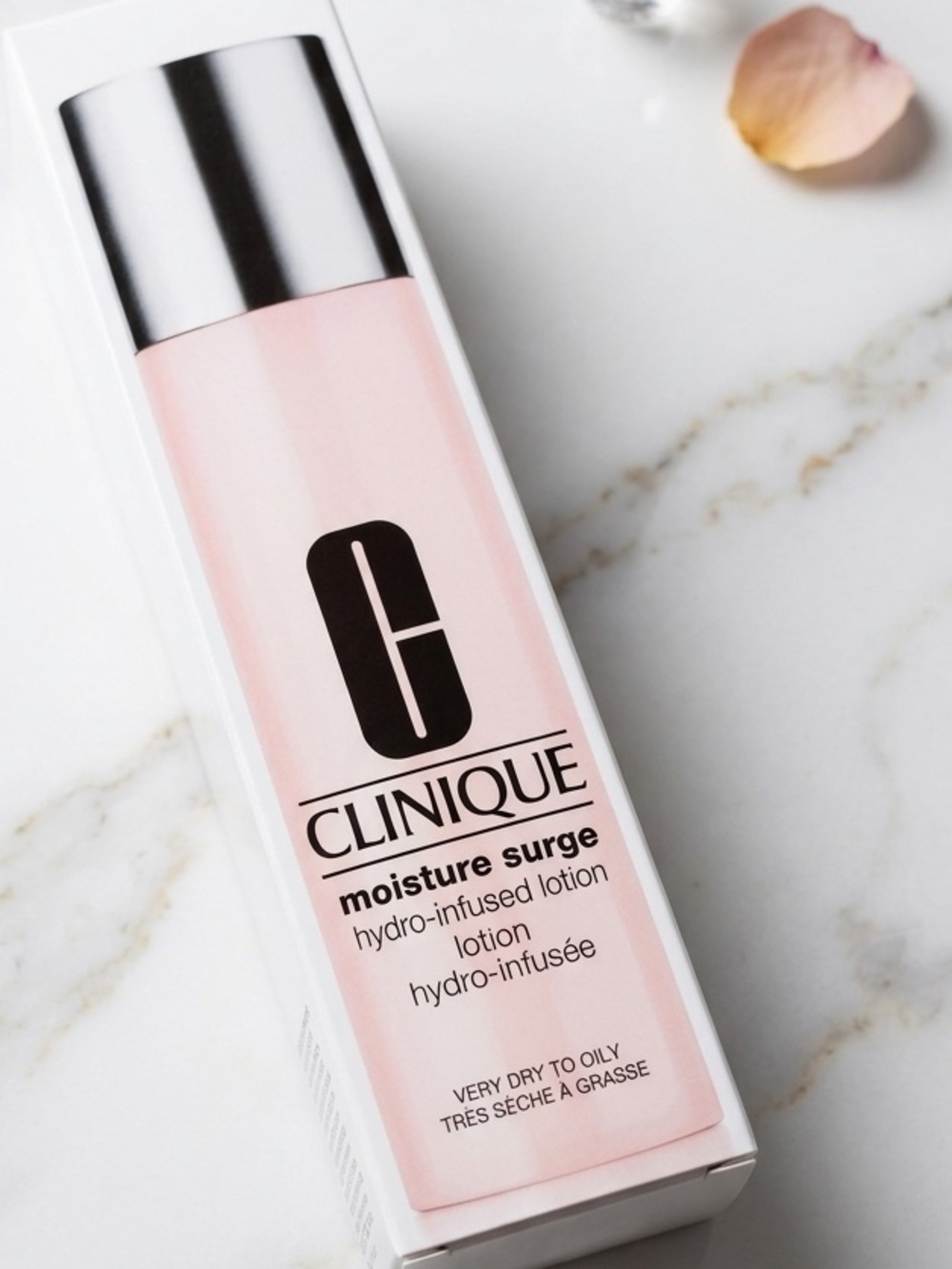 Clinique Moisture Surge Hydrating Lotion — Pale Pink Bottle with Silver Cap